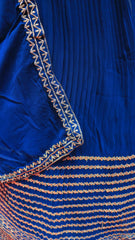 Royal blue gown with intricate silver embroidery